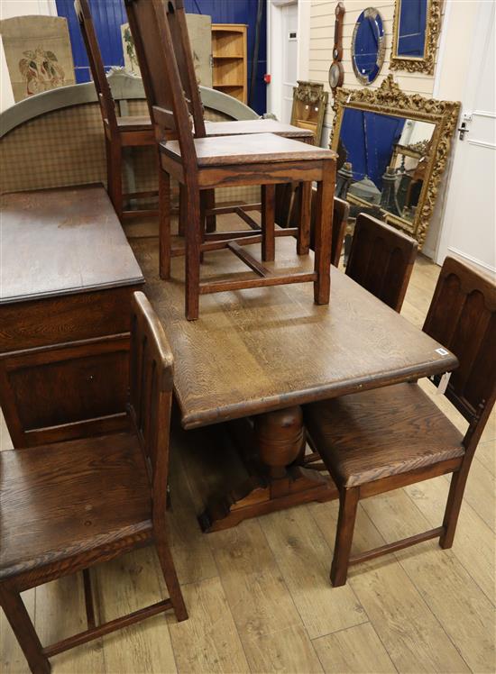 An 18th century style oak dining suite, comprising sideboard, refectory table and eight wood seated chairs Table W.182cm